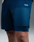 Short Padel Navy - léger - microfibre absorbante - poches porte-balles - cuissard de compression HOP.